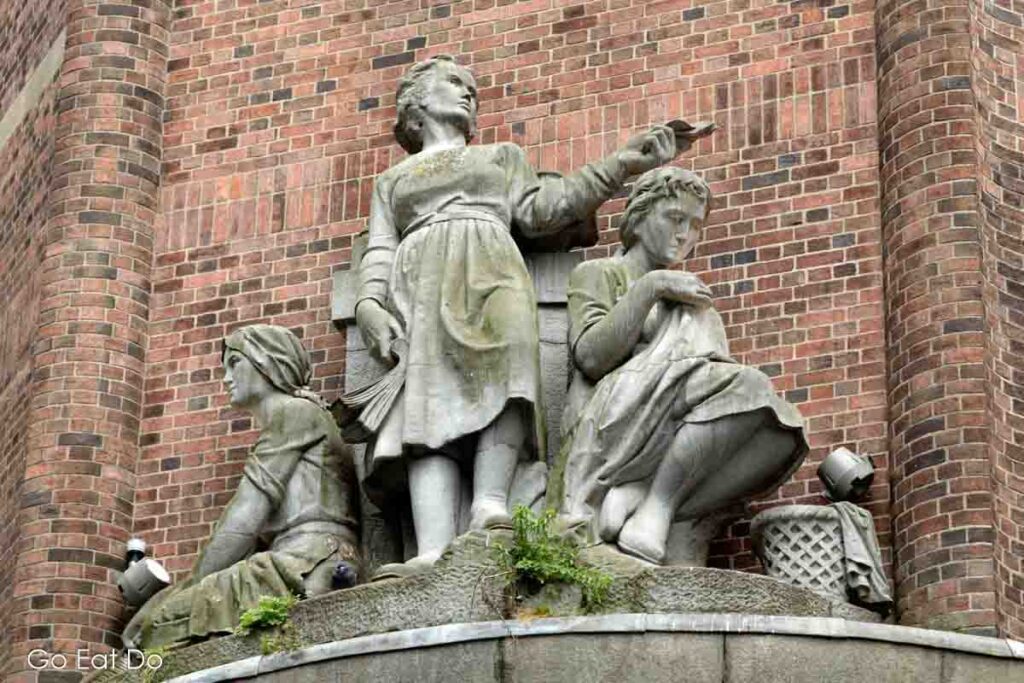 The Three Graces, by Gabriel Haye, on Cathal Brugha Street in Dublin, Ireland.
